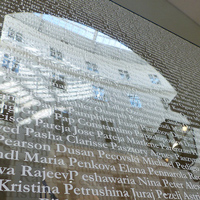 The atrium includes the names of 2,986 alumni plus skylines from Webster locations around the globe.