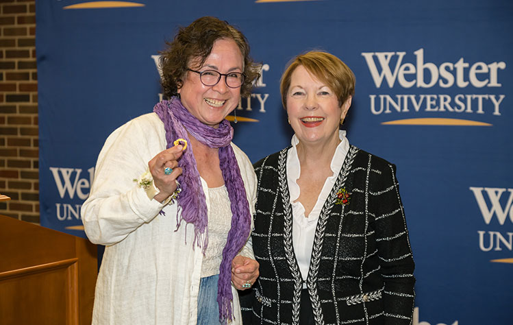 Recipient of a golden pin with Chancellor Stroble.