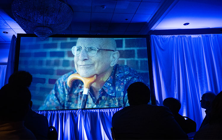A video from Awardee Richard Fox (BA '76) was played. 
