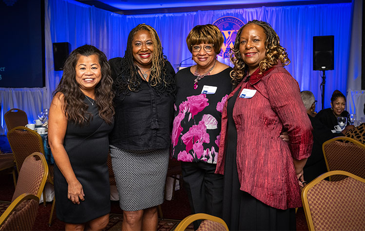 Awardee Jacqueline K. Dace (BA '05) (at right) with attendees.