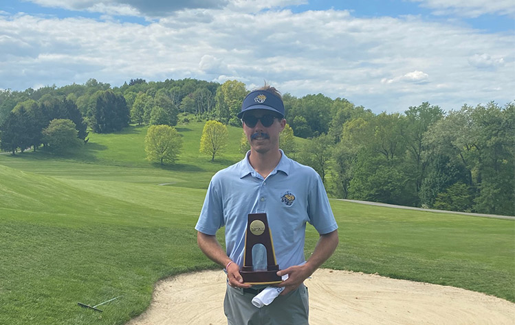 Will Hocker with the championship trophy