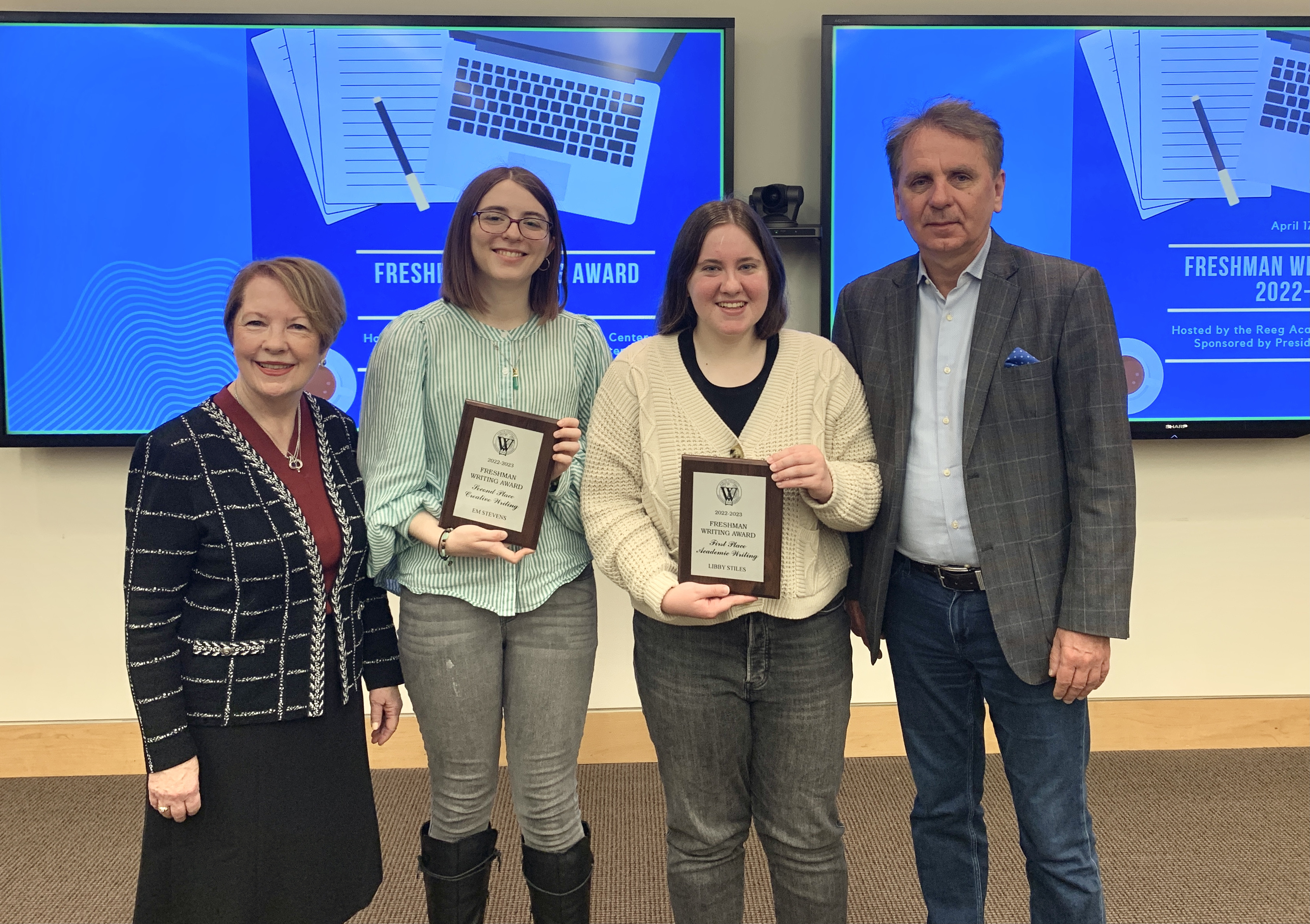 Pictured are Chancellor Stroble, Second Place in Creative Writing winner Em Stevens, First Place in Academic Writing Libby Stiles, and President Schuster.