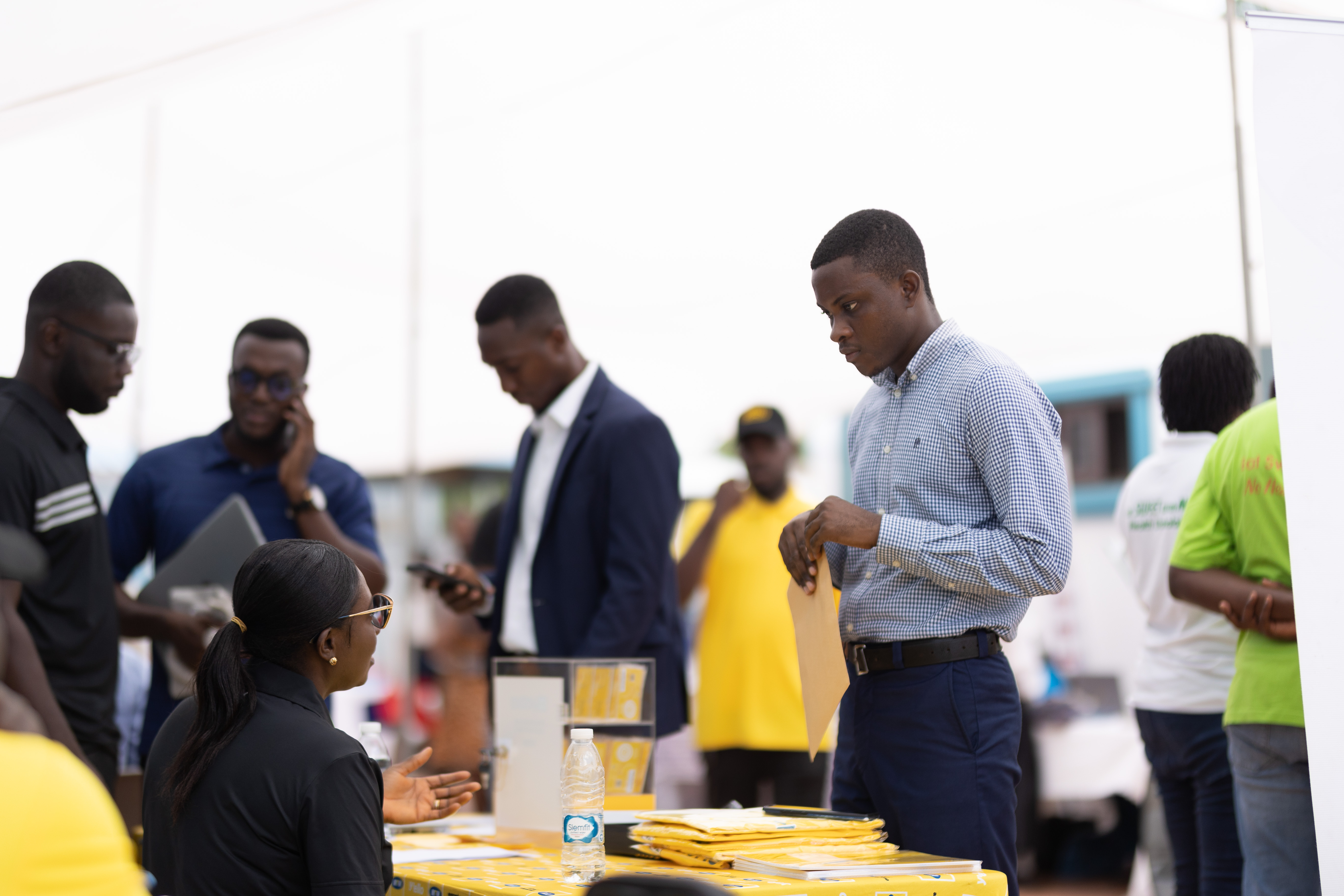 A Webster Ghana student speaks with a potential future employer.