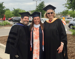 Emmy-award-winning School of Communications alumna Haley Walter along with professors Larry Baden and Mary Cox during her graduation in 2018