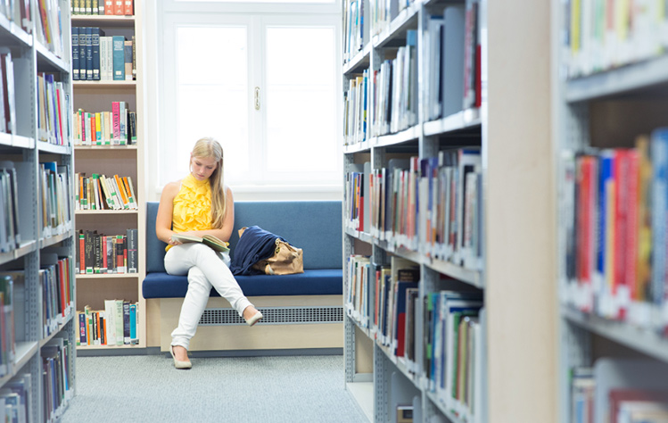 Student in Webster library