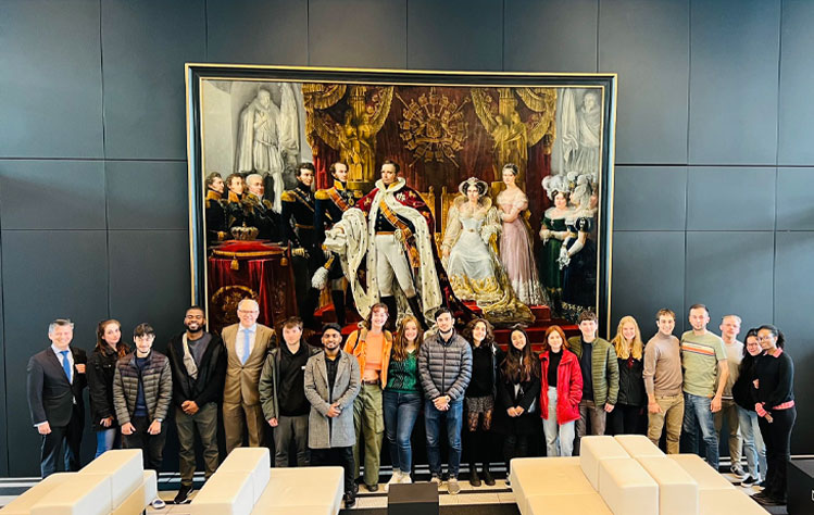 Picture taken at the Ministry in front of the painting of King William I, who also studied in Leiden