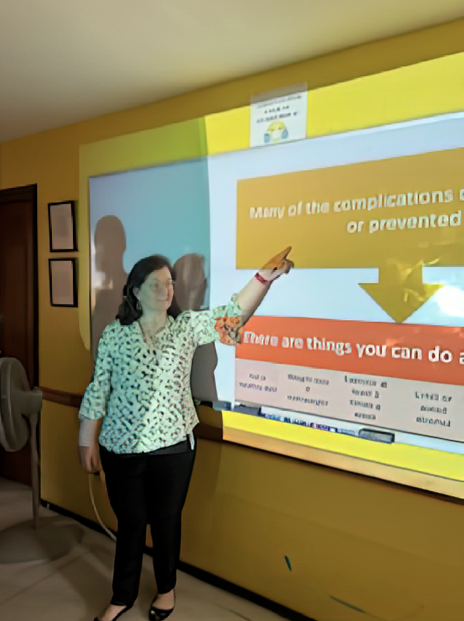 Sonja Auten leads a presentation about health for migrants.