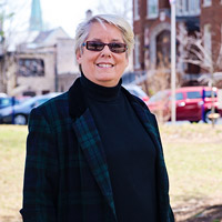 Linda Woolf's Webster Story Takes Her to Height of Her Field
