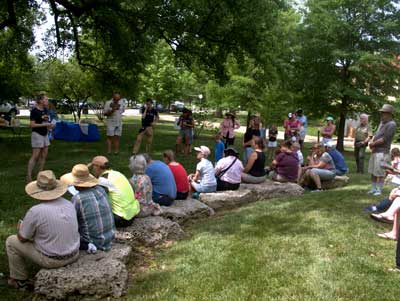 Professor Nicole Miller-Struttmann explains how to survey bees and takes questions from the more than 60 community volunteers