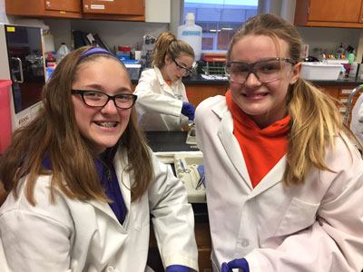 Girl Scouts in the lab at Webster University