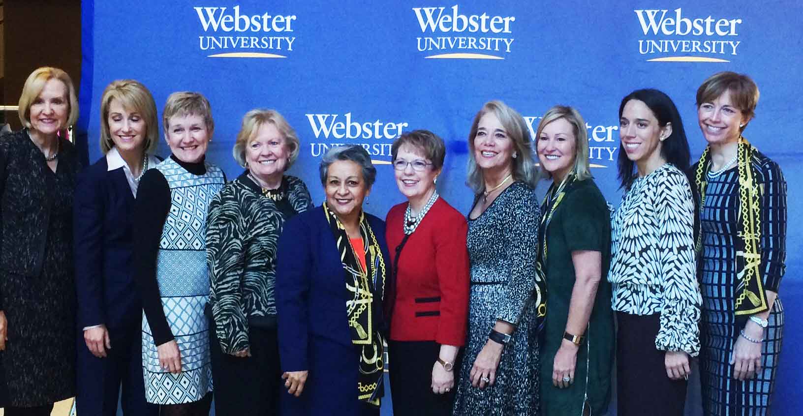 Sue Burnett, Kathy Mazzarella, Robin Ross, Donna Van Eekeren, Webster University Trustee Carmen Jacob, Webster University President Beth Stroble, Laura Herring, Joyce Russell, Lauren Herring, and Mary Evans