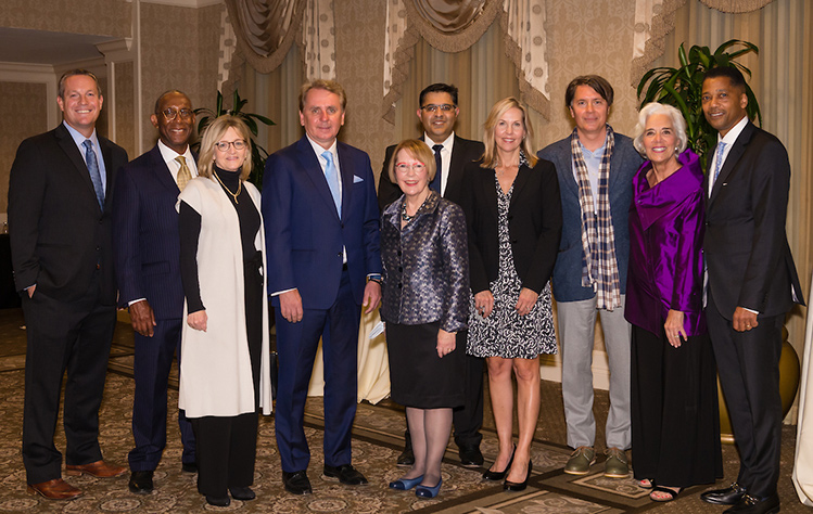 The chancellor and president with members of the board of trustees