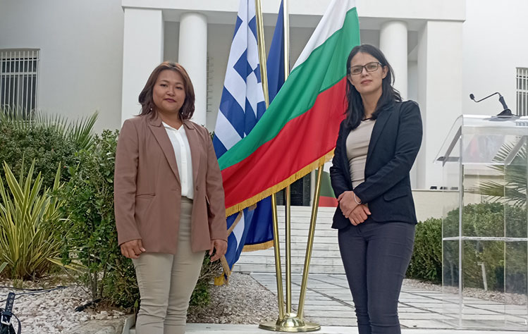 Two international relations students from Webster Athens at an embassy reception.