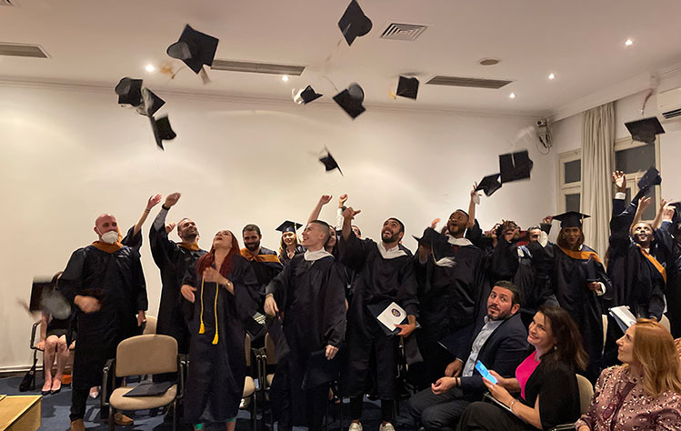 Webster graduates in Athens toss their caps