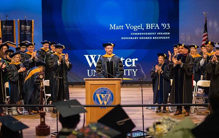 Matt Vogel receives an honorary doctorate degree during the 2023 Webster University Commencement ceremony.