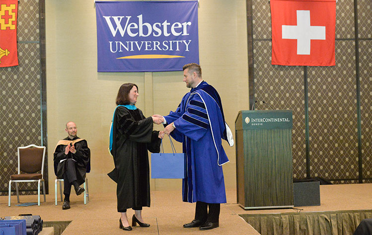 Crocker is thanked by Guffey for speaking at Webster Geneva's Commencement.