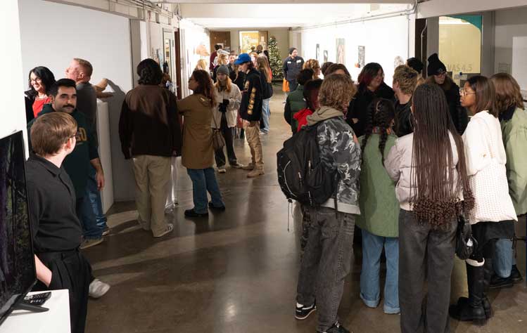 A large crowd gathers to view the work of DADAH students