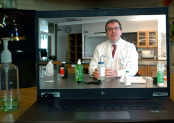 Dean Wallner demonstrates home sanitizer chemistry for TV news