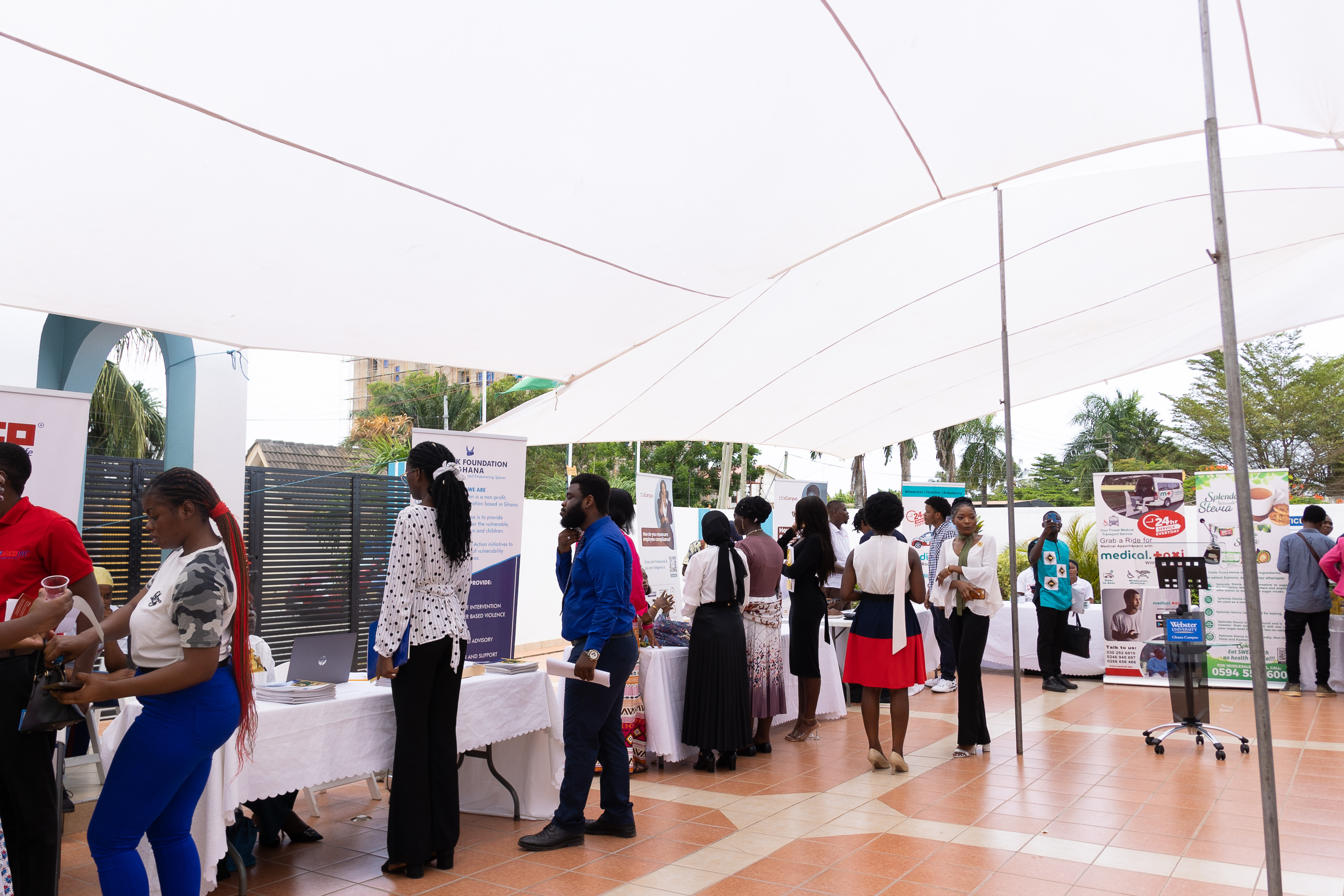 Students browse the booths at Webster Ghana's second career fair.