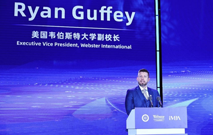 Ryan Guffey addresses the 2026 Spring Alumni Annual Reunion of the international MBA (iMBA) program