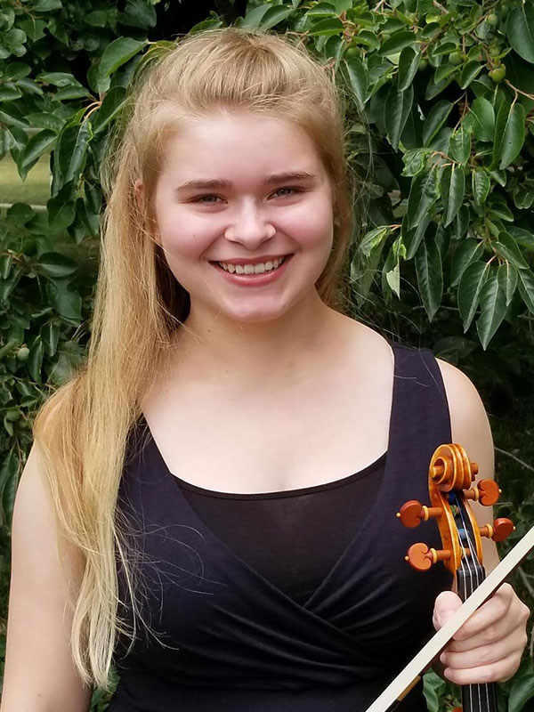 Sophia Heaton holding a violin.