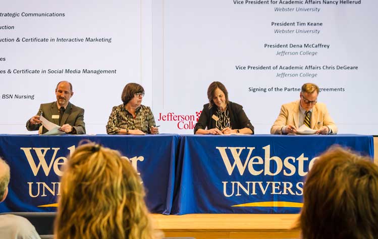 Officials from Webster University and Jefferson College sign several articulation agreements