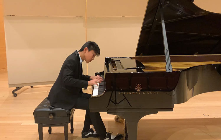 Jerry Chang playing piano.