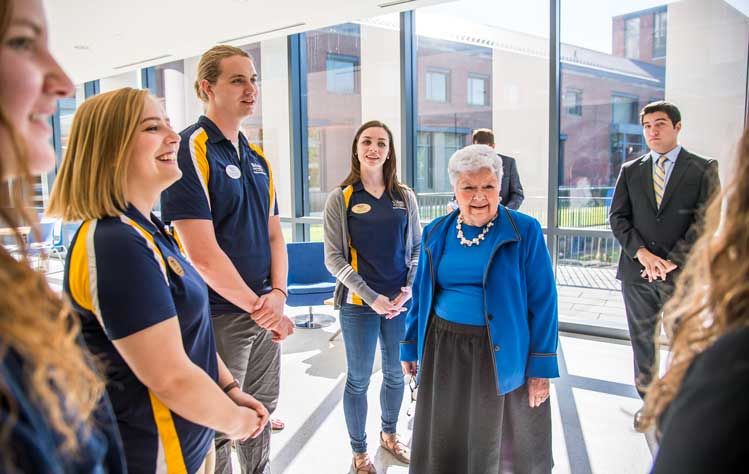 Jinny Browning is greeted by students after stepping inside Browning Hall for the first time.