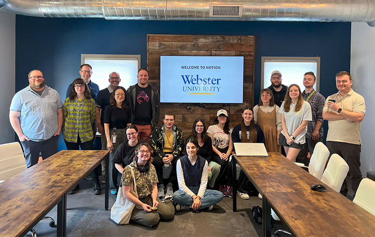 Webster University graphic design students during a studio tour hosted by Notion in summer 2023.