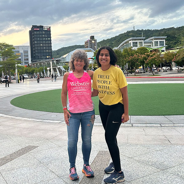 Palmer with her former student, Neha Pu.