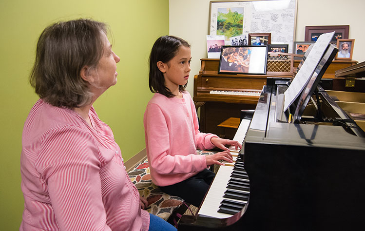 Vera Parkin teaching piano
