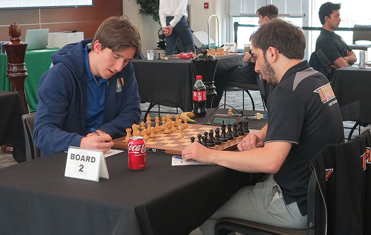 Webster Chess Player Benjamin Gledura plays against University of Texas Rio Grande Valley player Irikali Beradze.