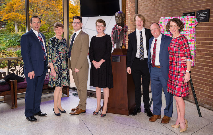 The Sargent family with a bust of Peter E. Sargent