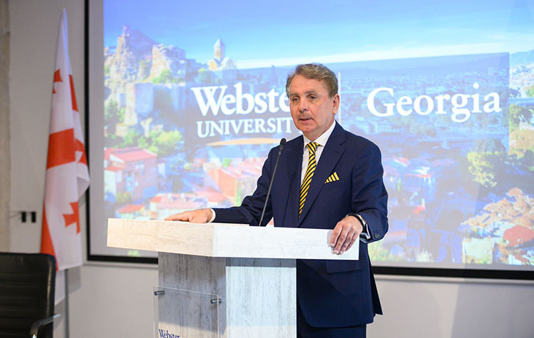 President Schuster greets guests at the Georgia campus 