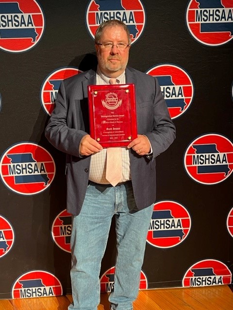 Scott Jensen holding award
