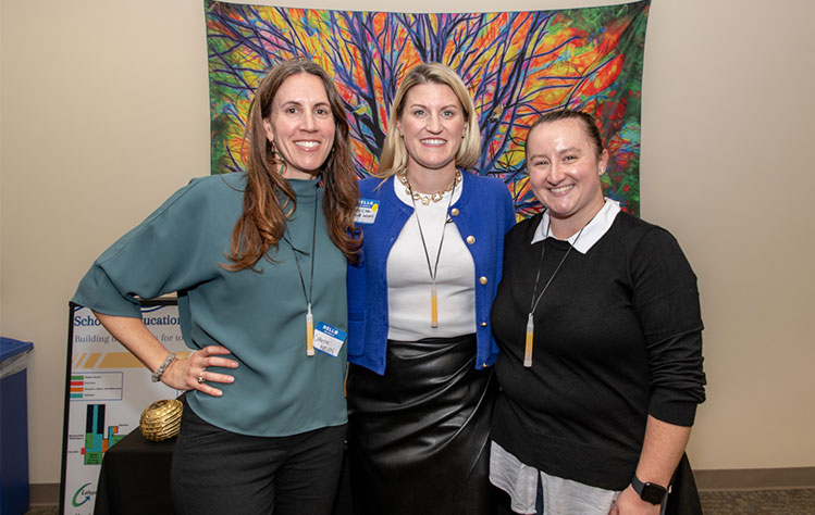 Representatives from the organizations who sponsored the School of Education Expo event: Catherine White Guimarães, Director of Education, Mursion, Stacey Elster, Chief Program Officer, Lafayette Industries, and Kaylee Reagan, Kaylee Reagan Photography.