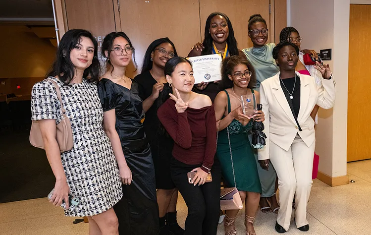 A group of student leaders pose with a leadership certificate.