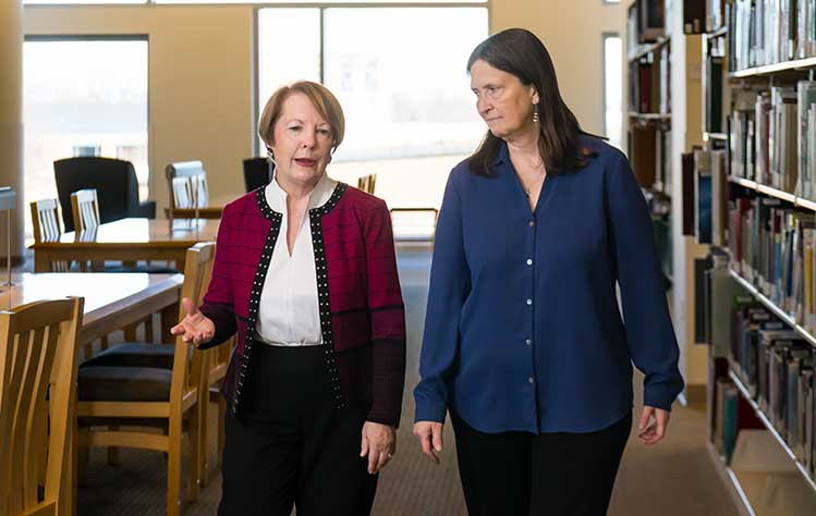 Chancellor Stroble and Susan Perabo talk while filming the documentary