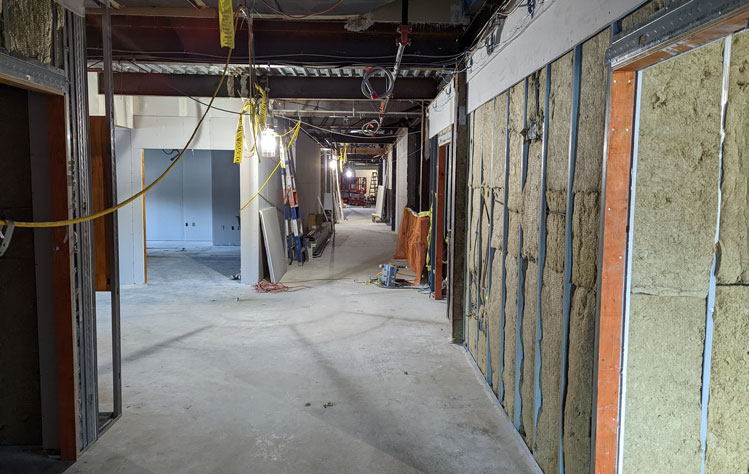 The second floor hallway, taken on April 22, 2022. The previous walls have been removed and new ones are being built.