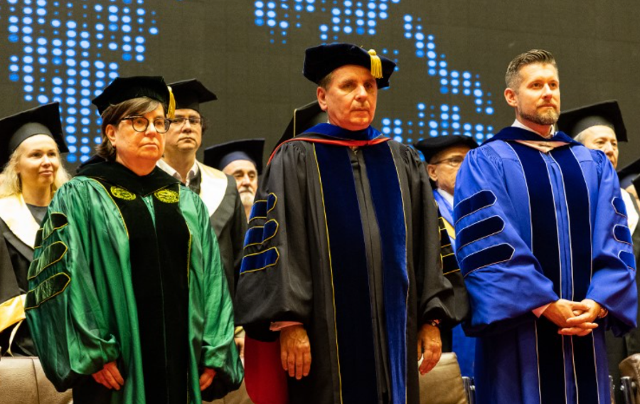 Webster University Vice President Nancy Hellerud, President Julian Z. Schuster, and Director General for Global Campuses Ryan Guffey.