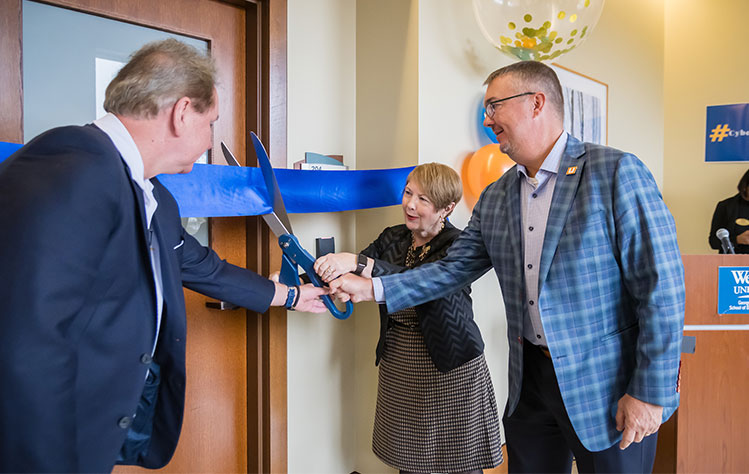 President Schuster, Chancellor Stroble, and UNCOMN CEO Jason Carter cut the ribbon.