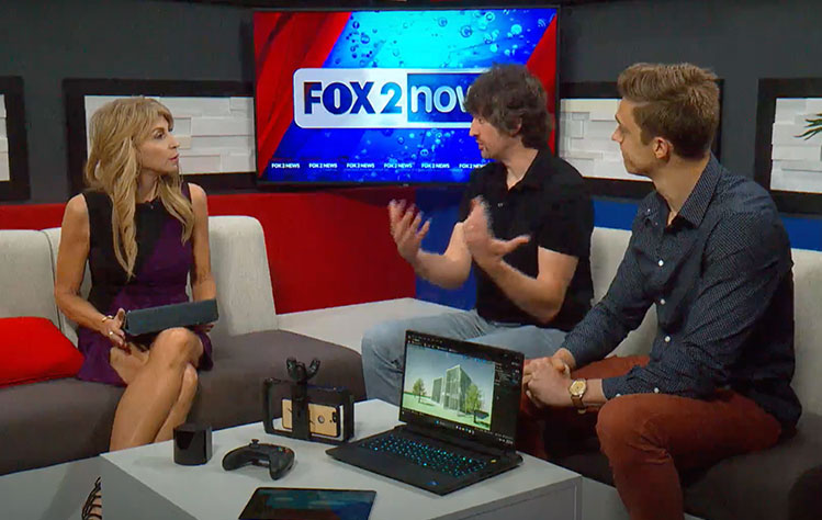 Josh Johnson and Matthew Burton sit in a TV studio with a news anchor.