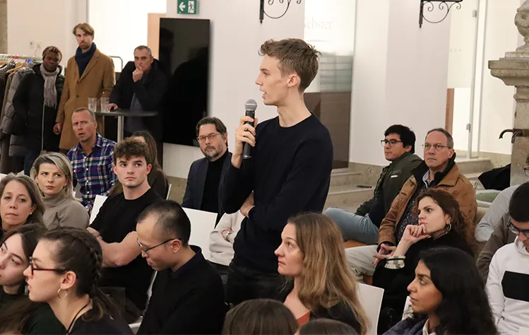 A student in the audience shares thoughts during the roundtable discussion on Nov. 20.