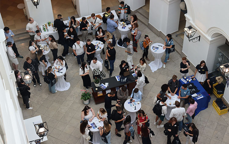 A group of WVPU freshman gather in the Palais Wenkheim atrium.