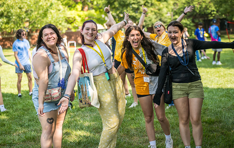 Four Webster students having fun during Webster's Quad Games day.