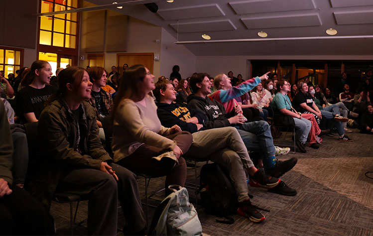 Webster students view a project at the Webster 48 final screening.