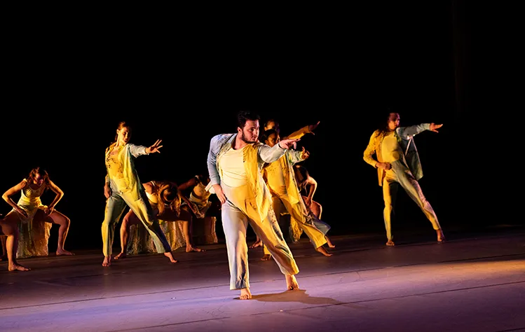 A group of dancers confidently extend their arms. Photo by Gerry Love.